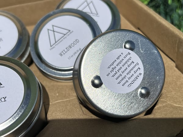 Small Tin variety artisan soy candles with footed base